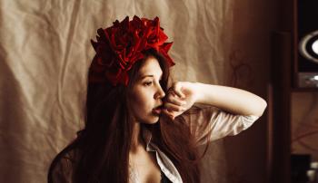 Photography of a Woman Wearing Red Flower Headdress