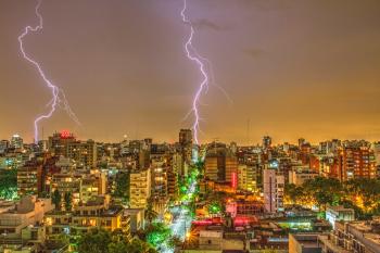 Photography of Thunder Strike Behind City
