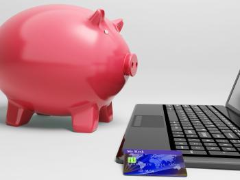 Piggy At Computer Shows Banking On Laptop