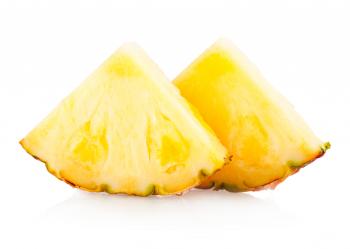 Pineapple with slices isolated on white
