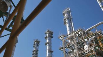Refinery tower and steel pipe line in process area of Industrial ...