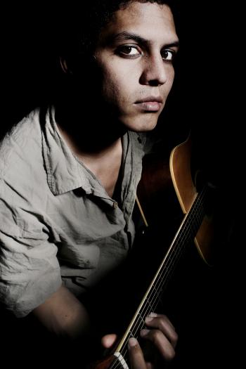 Portrait man playing guitar