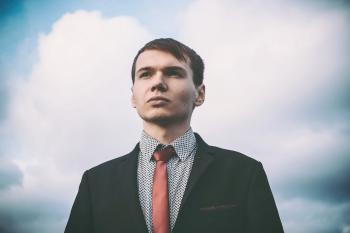 Portrait of Young Man Against Sky