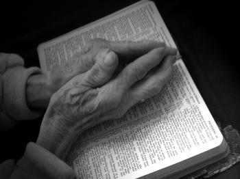 Praying Hands on Bible - Black and White