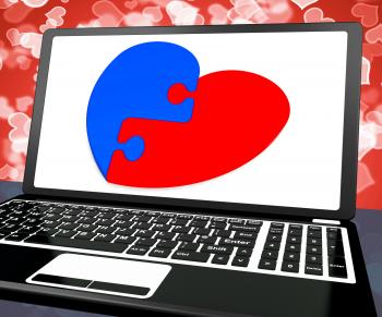 Puzzle Heart On Laptop Shows Engagement