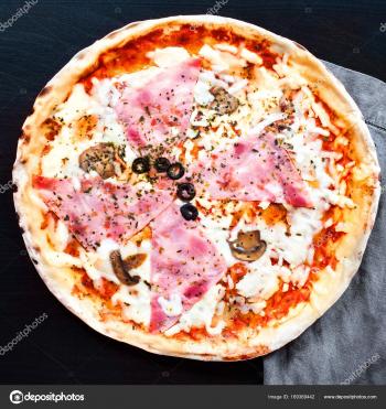Delicious raw italian pizza — Stock Photo © Zakharova #169369442