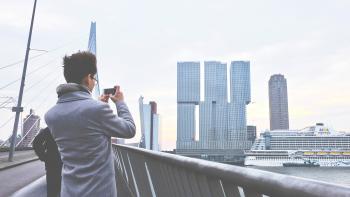 Rear View of Man Photographing Cityscape