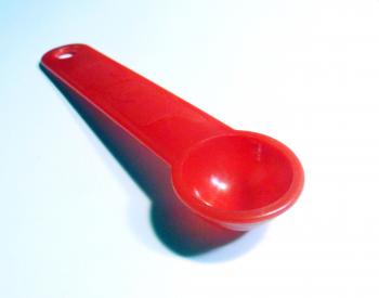 Red plastic teaspoon