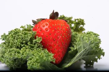 Red Strawberry on kale