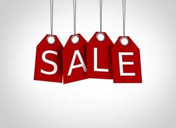 Red tags dangling with the word sale - Sales concept