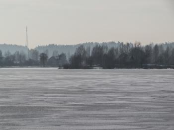 River covered with a thick layer of ice