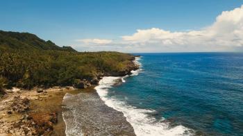 Rocky coast line of Island Siargao. Aerial view sea rocky coast ...