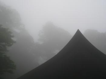 Roof of Japanese Buddhist mountain temple in the mist.