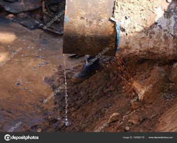 Rusty Old Iron Pipe With Clear Water Flowing From It. Waste water ...