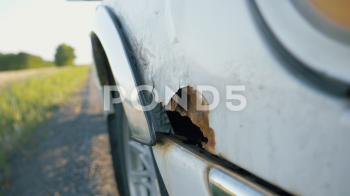 Rust Hole on The Paint of a Car Closeup ~ Footage #76744463