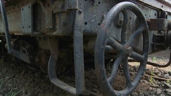 Old rusting parts of a steam train including a handbrake. Stock ...