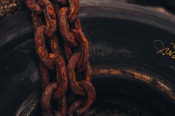 Rusty Chain on Rubber Tire