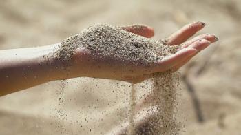 The macro snapshot of hand with sand strewed to fingers Stock Video ...