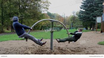 Couple Spin On The Seesaw Springer And The Girl Ge Stock video ...