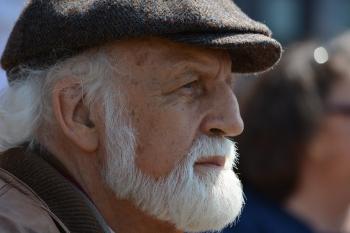 Selective Focus Photography of Man in Flat Cap during Daytime