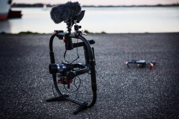 Shallow Focus Photography of Black Quadcopter Near Body of Water