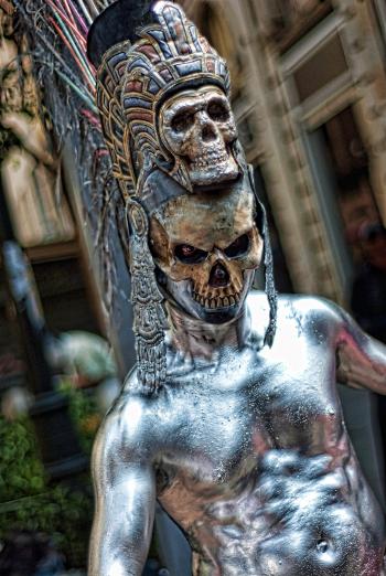 Shallow Focus Photography of Silver Skeleton Statue