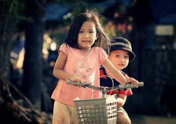 Siblings with a Bike