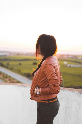 Side View of Woman Wearing Brown Leather Jacket