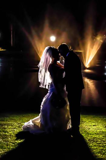 Silhouette of Bride and Groom on Grass Field during Night Times
