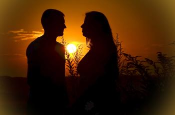 Silhouette of Man and Woman during Sunset