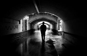 Silhouette Photo of a Man in a Tunnel
