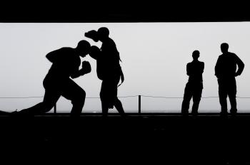 Silhouette Photo of a Men Fighting