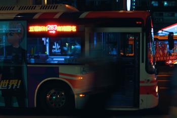 Silver City Bus on a City Street at Night