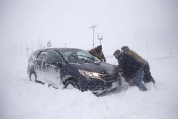 Photos: Powerful snowstorm brings travel to a standstill in coastal ...