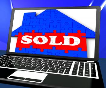 Sold On House On Laptop Shows Sold Property