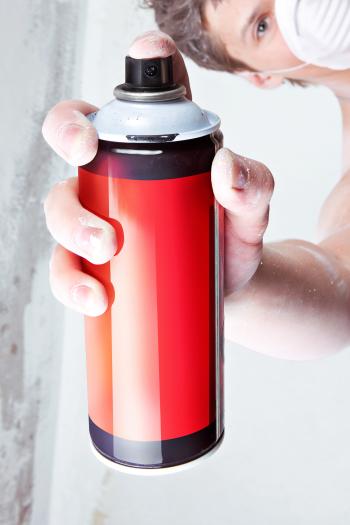 Spray can in hand