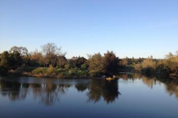 Free Stock Photo of Canoe on Still River Bend