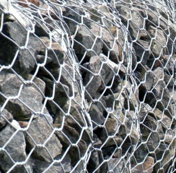 Stone In Chain Link Fence Texture