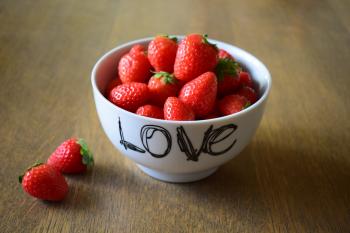 Strawberry on White Ceramic Bowl