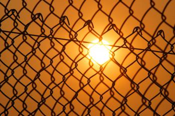 Sun over the Cyclone Fence