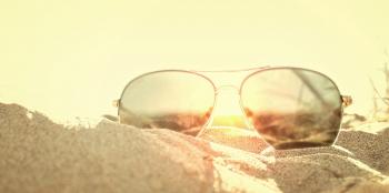 Sunglasses on the Sand at Sunse