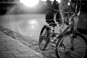 Tandem Bicycle on Sidewalk in Greyscale Photography