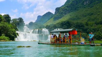 Ban Gioc Waterfall - May 2015: Tourists on bamboo rafts cruising ...