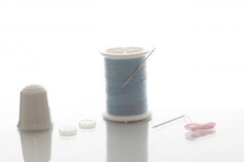 Thimble, buttons and thread
