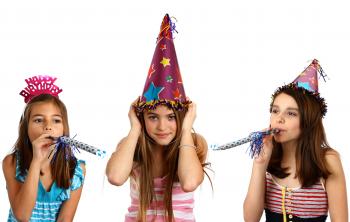 Three young girls celebrating a birthday