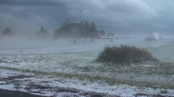 Fog forms as warm moist air flows over hail-covered ground after a ...
