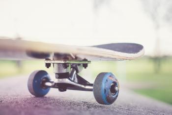Tilt Shift Lens Photography of Black Skateboard