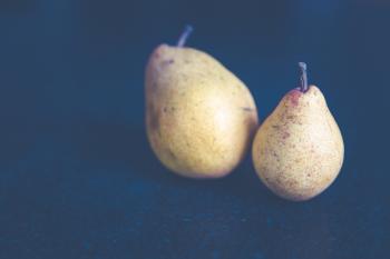 Tilt Shift Photo of Two Pears