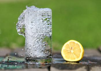 Time Lapse Photography of Water Bobbling Beside Lemon Fruit