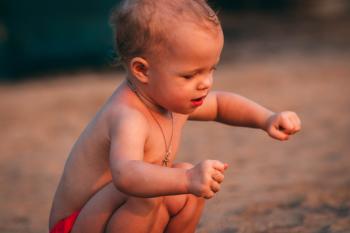 Toddler Playing With Sand